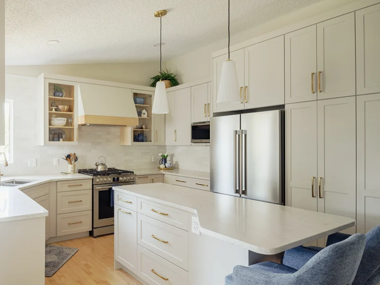 Full view of kitchen with custom island, pendant lighting, fridge wall, and open shelving — kitchen renovation in Spruce Grove, AB